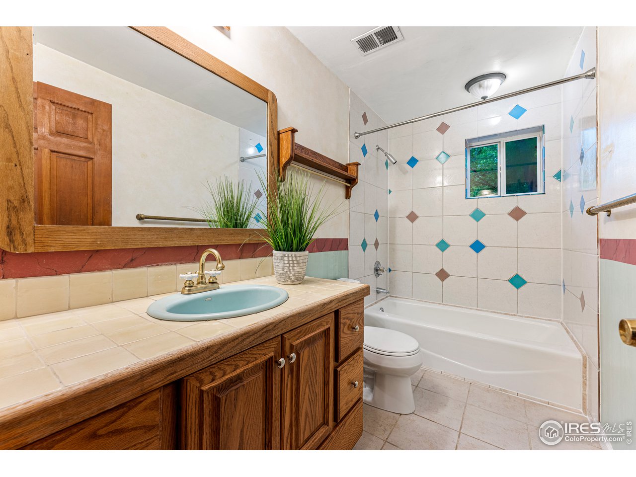 4731 Jay Road Boulder, CO 80301 - Photo 14 of 33 a bathroom with a sink a toilet tub and shower