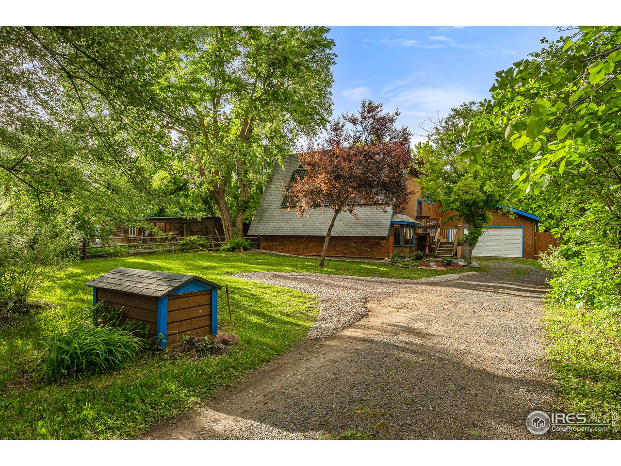 4731 Jay Road Boulder, CO 80301 - Photo 2 of 33 a backyard of a house with table and chairs