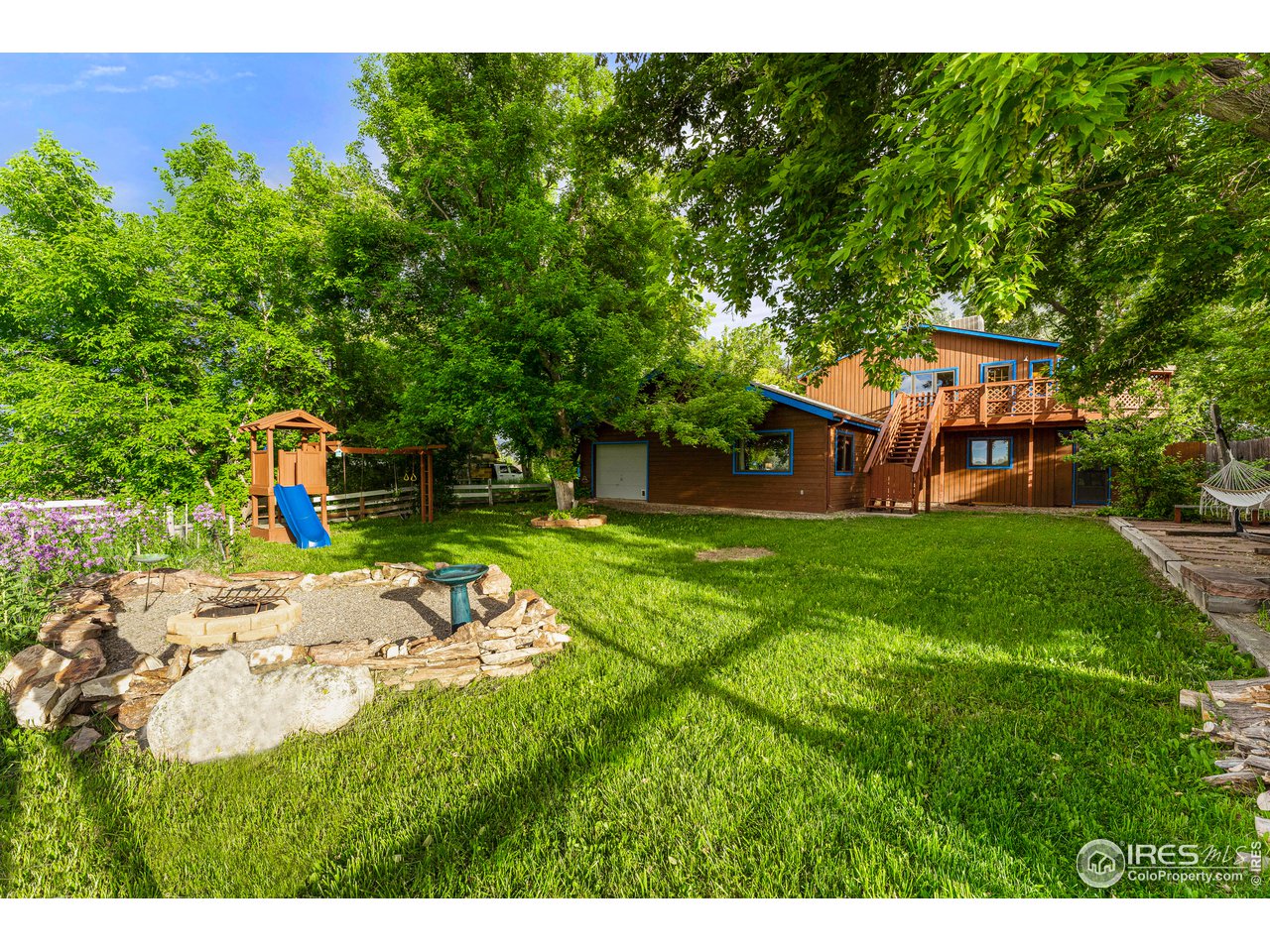 4731 Jay Road Boulder, CO 80301 - Photo 25 of 33 a backyard of a house with table and chairs