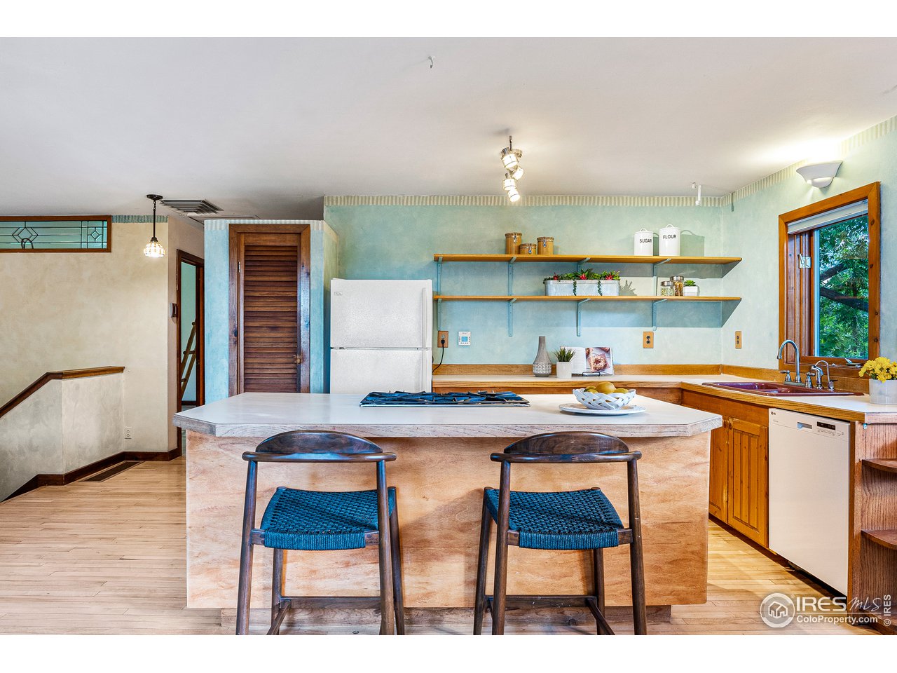 4731 Jay Road Boulder, CO 80301 - Photo 8 of 33 a room with a table chairs and a wooden floor