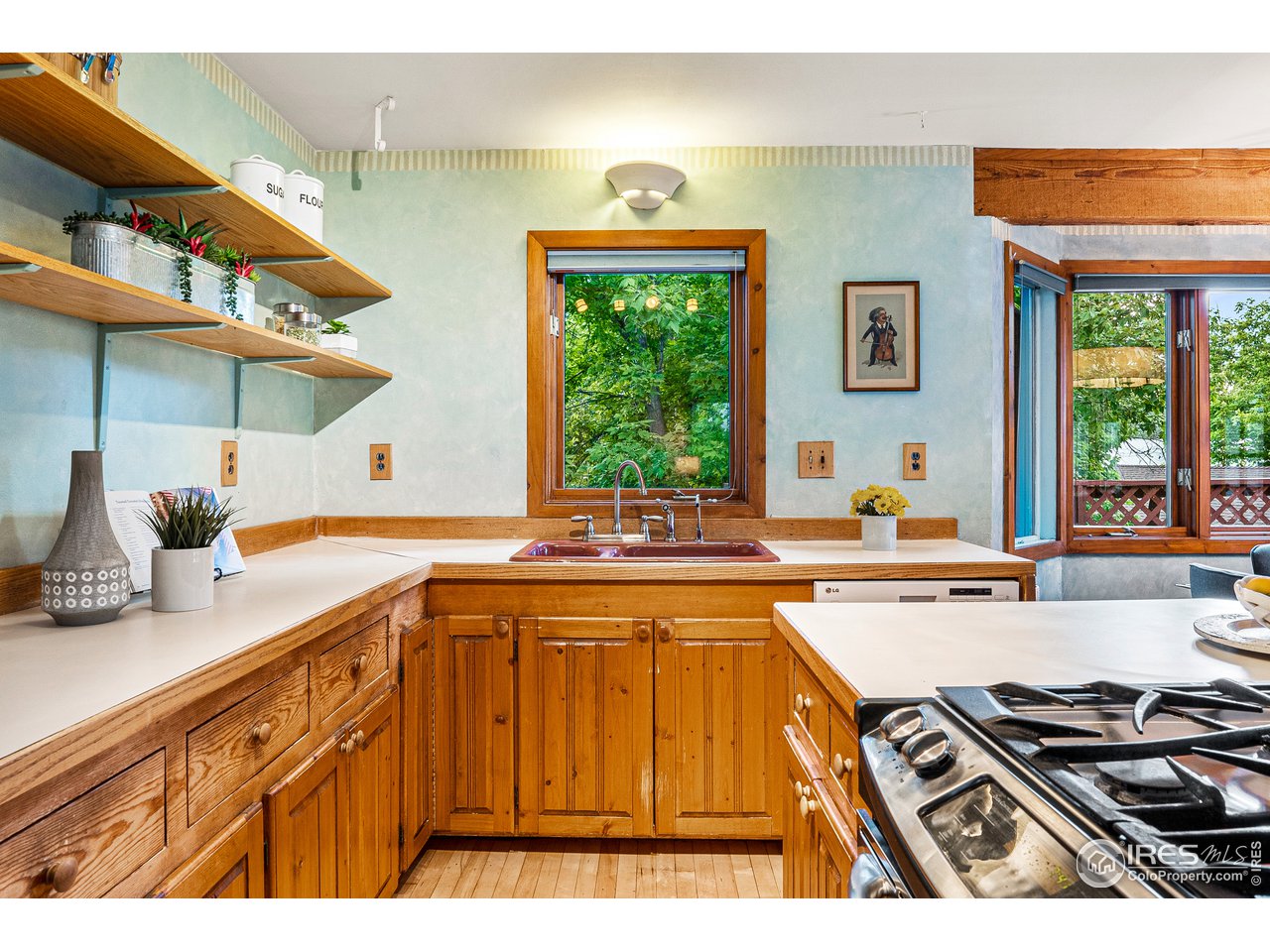 4731 Jay Road Boulder, CO 80301 - Photo 9 of 33 a kitchen with stainless steel appliances granite countertop a sink stove and window