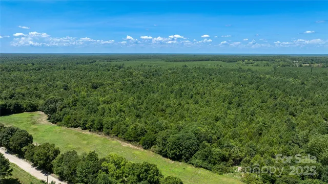 a view of a green field with an outdoor space