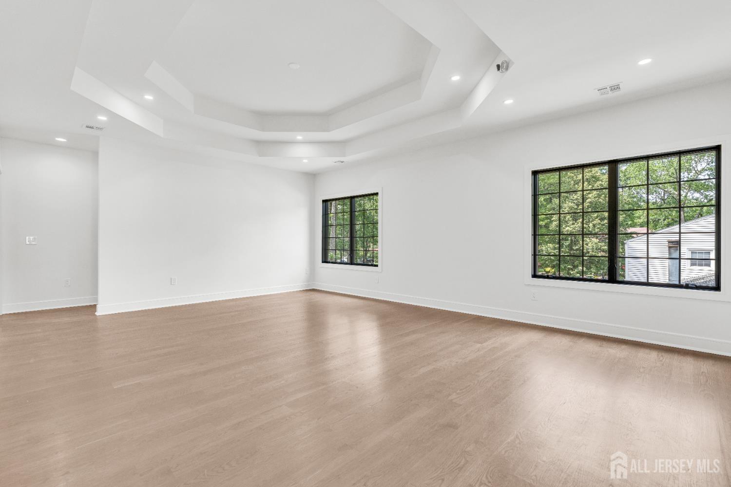28 Harding Avenue Edison, NJ 08820 - Photo 23 of 62 an empty room with wooden floor and windows