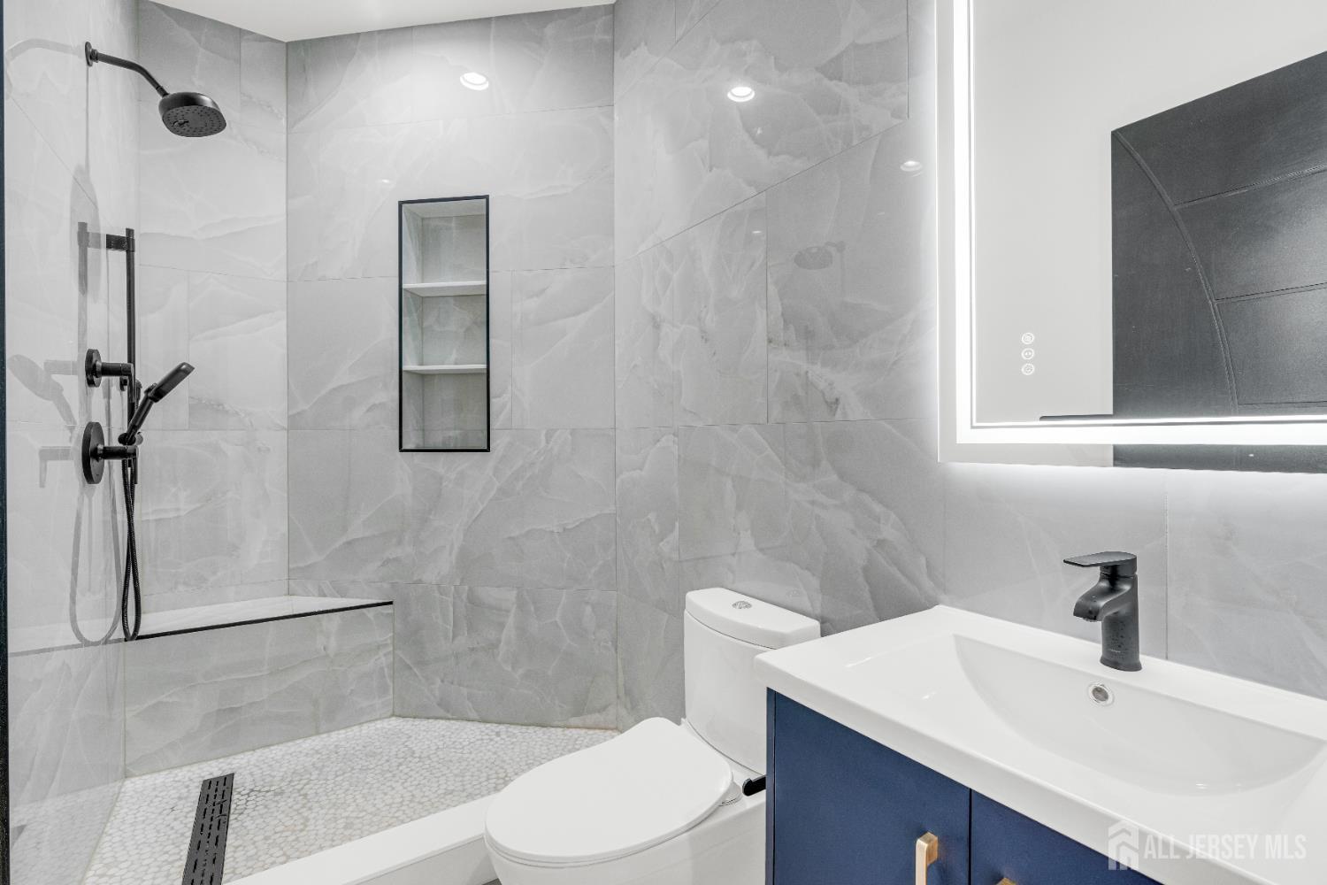 28 Harding Avenue Edison, NJ 08820 - Photo 35 of 62 a bathroom with a sink toilet and shower