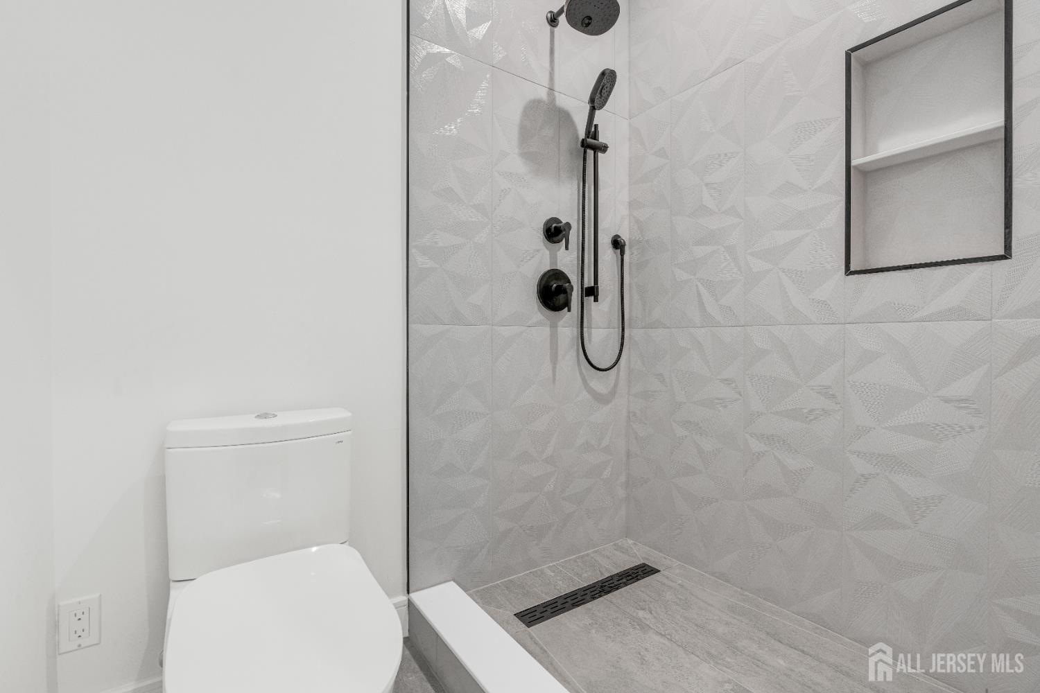 28 Harding Avenue Edison, NJ 08820 - Photo 39 of 62 a bathroom with a toilet and a shower