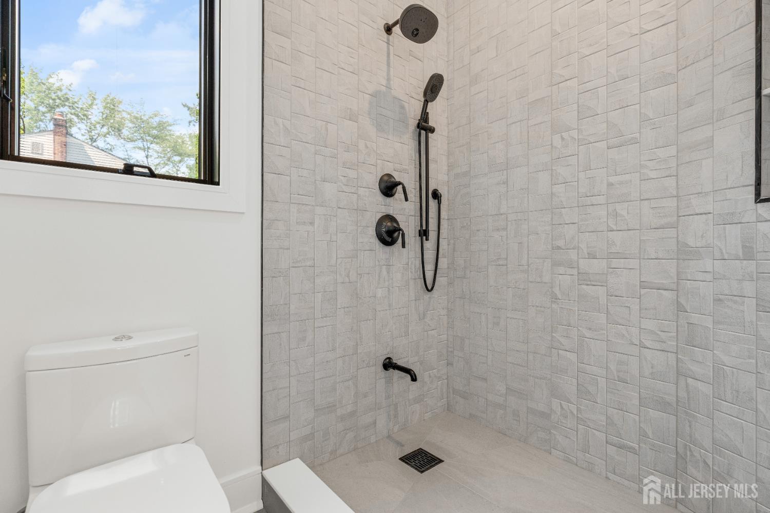 28 Harding Avenue Edison, NJ 08820 - Photo 45 of 62 a bathroom with a shower and toilet