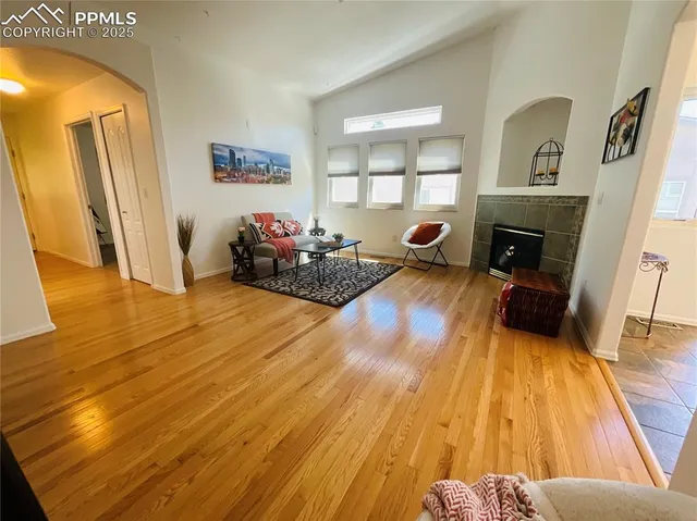 a bedroom with furniture and a fireplace