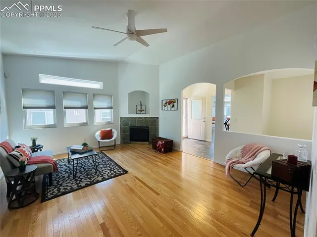 a living room with furniture and a fireplace