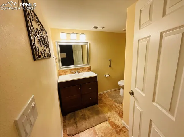 a bathroom with a double vanity sink and mirror