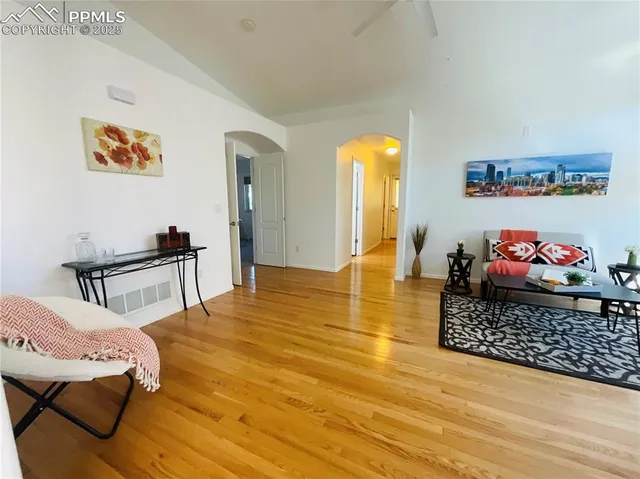 a living room with furniture and a table