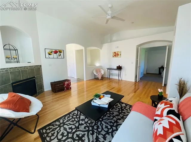 a living room with furniture and a fireplace