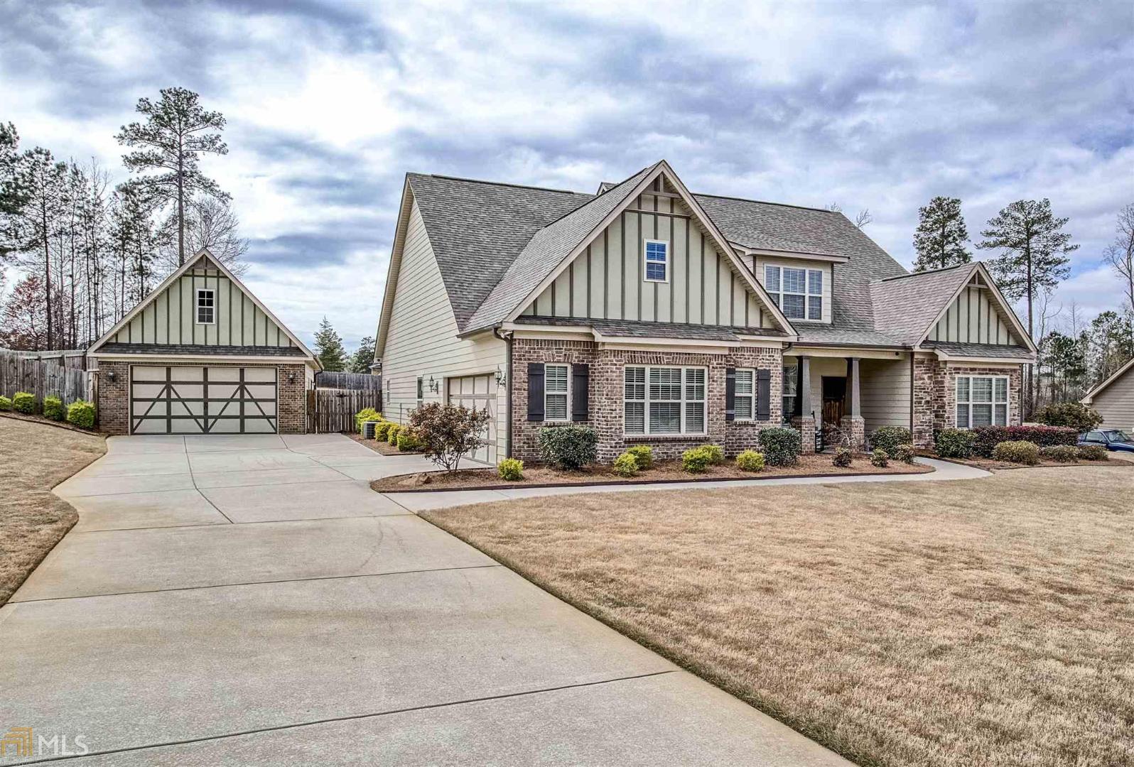 145 Caraway Road Locust Grove, GA 30248 - Photo 1 of 1 a front view of a house with a yard