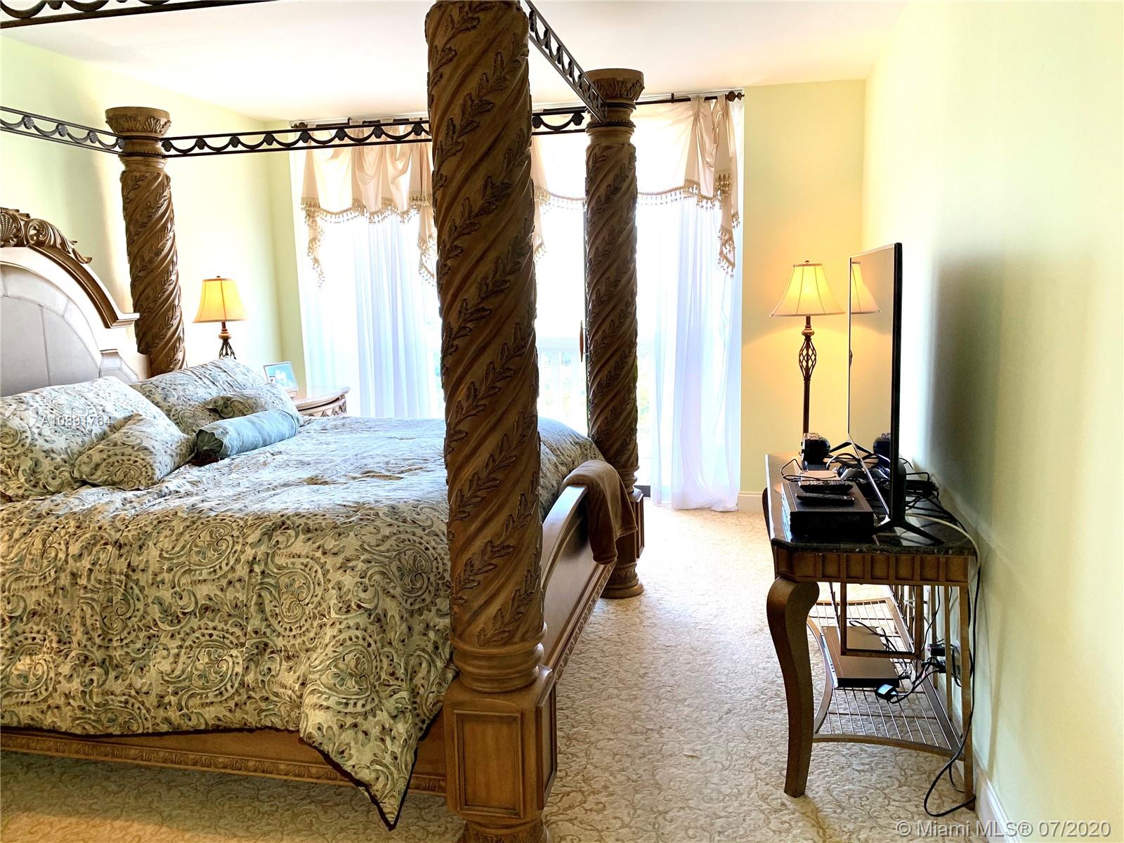 Williams Island Aventura, FL 33160 - Photo 17 of 23 a living room with furniture and a floor to ceiling window