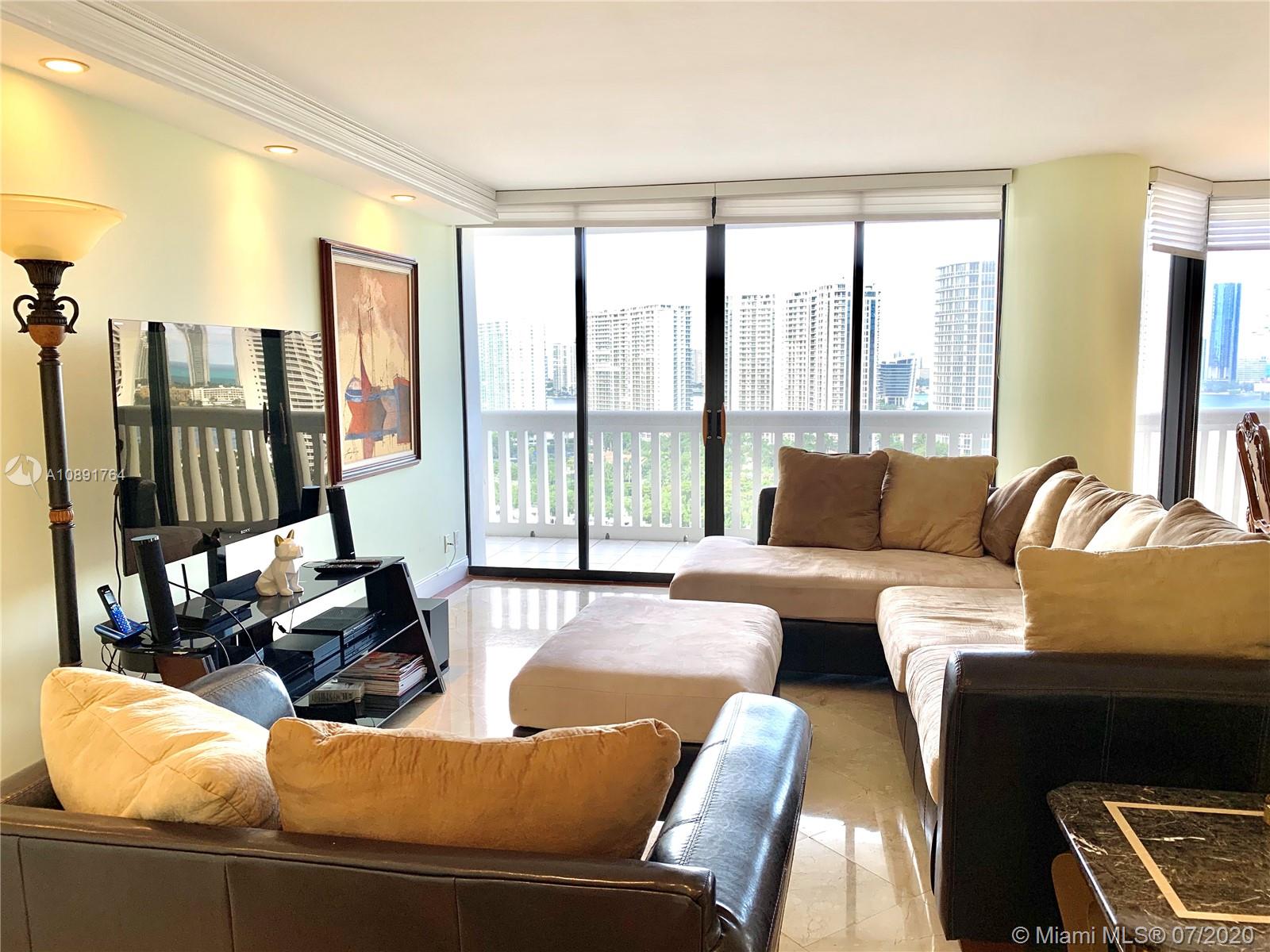 Williams Island Aventura, FL 33160 - Photo 5 of 23 a living room with furniture and floor to ceiling windows