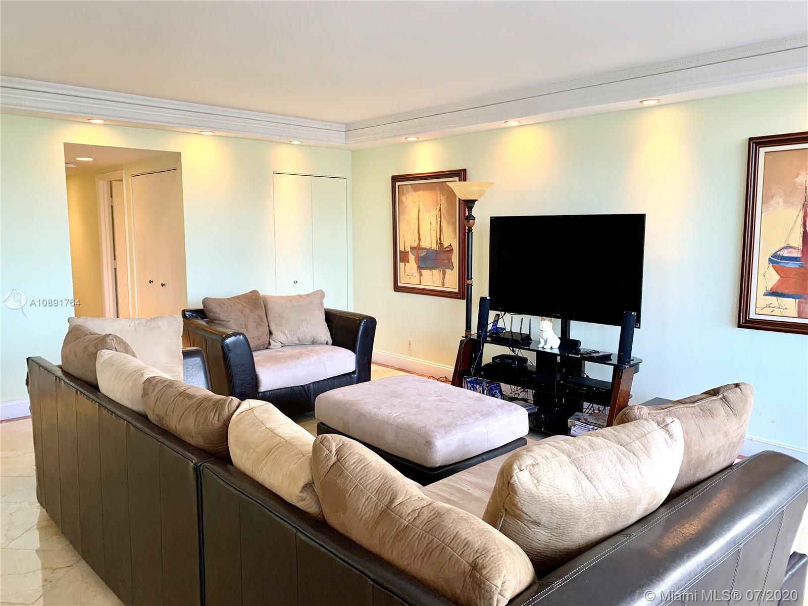 Williams Island Aventura, FL 33160 - Photo 6 of 23 a living room with furniture and a flat screen tv