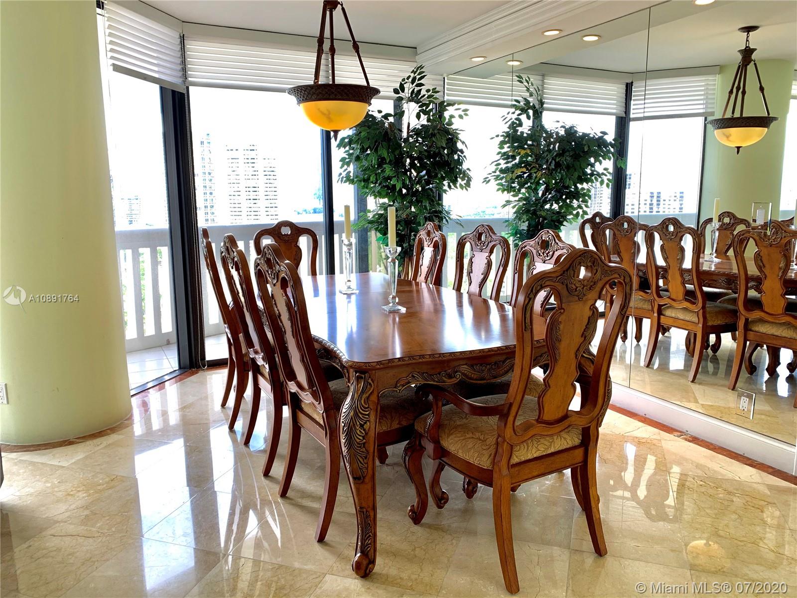 Williams Island Aventura, FL 33160 - Photo 9 of 23 a view of a dining room with furniture window and outside view
