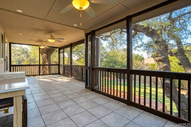 a view of hallway with furniture and a large window