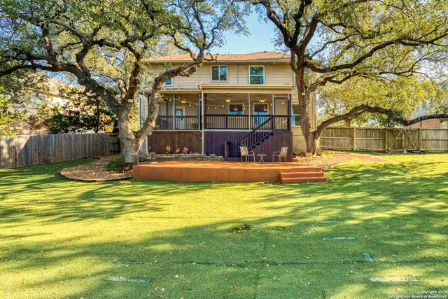a house view with swimming pool in front of it