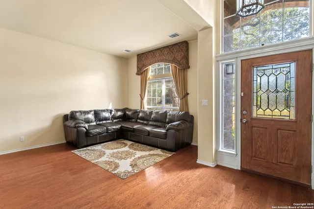 a living room with furniture and a window