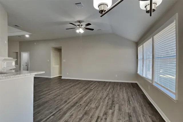 a kitchen with stainless steel appliances a refrigerator stove microwave and sink