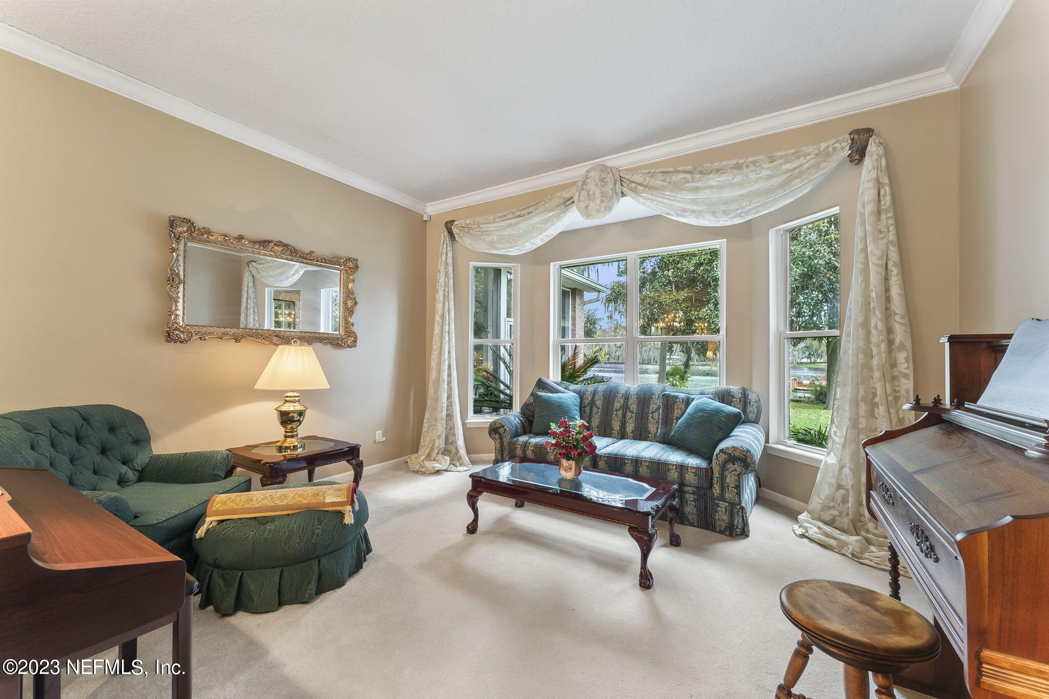 42 Harmony Hall Road Middleburg, FL 32068 - Photo 11 of 70 a living room with furniture and a flat screen tv