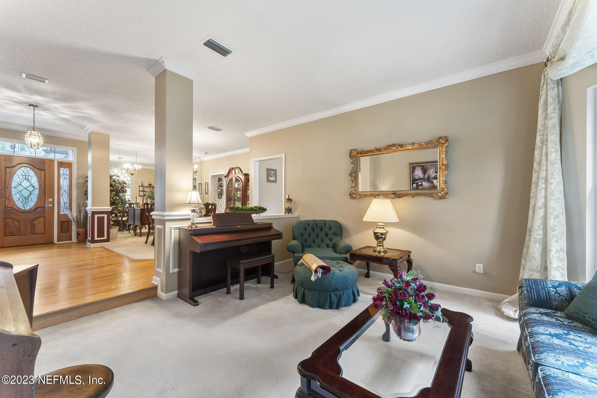 42 Harmony Hall Road Middleburg, FL 32068 - Photo 13 of 70 a living room with furniture and a potted plant