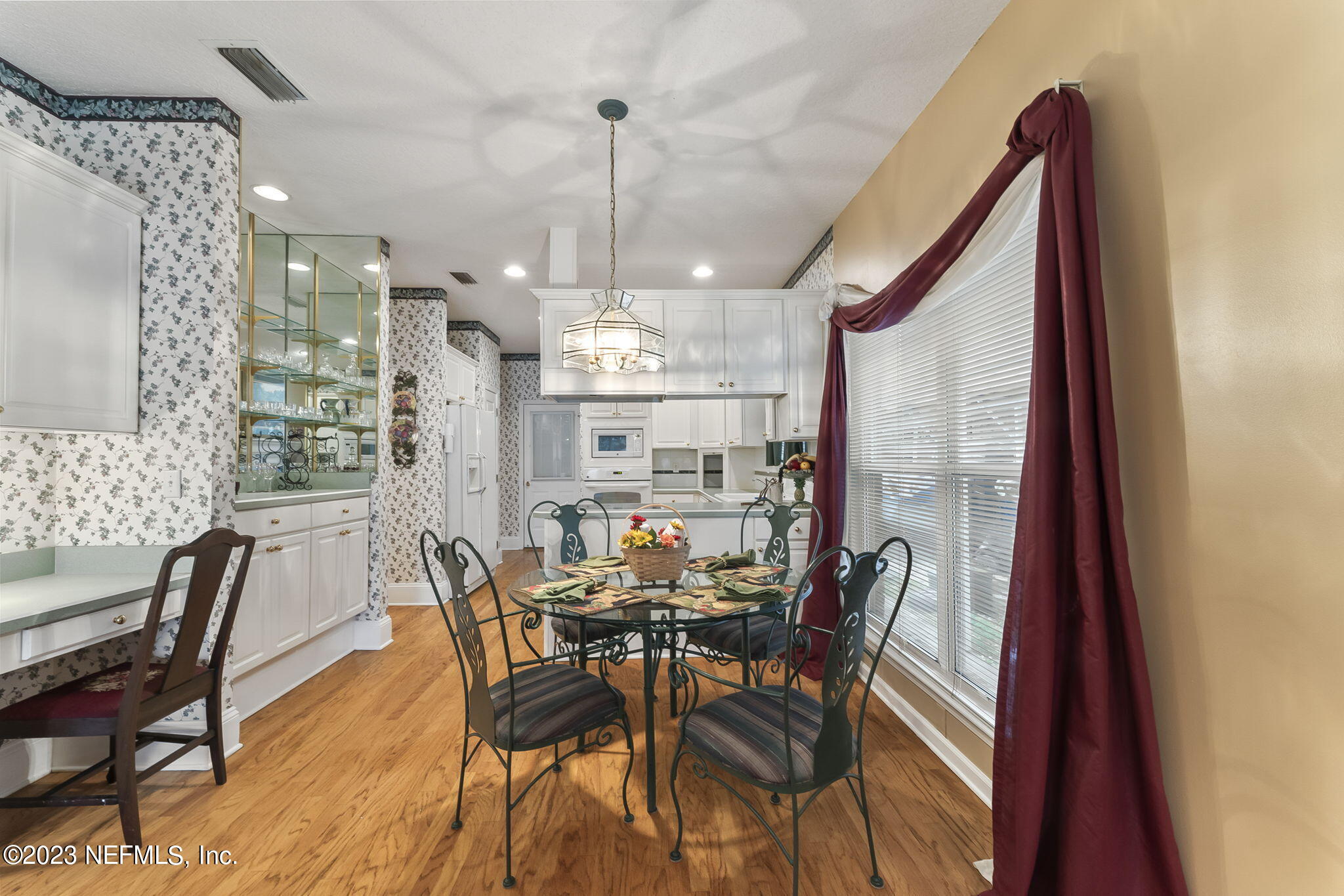 42 Harmony Hall Road Middleburg, FL 32068 - Photo 18 of 70 a view of a dining room with furniture window and wooden floor