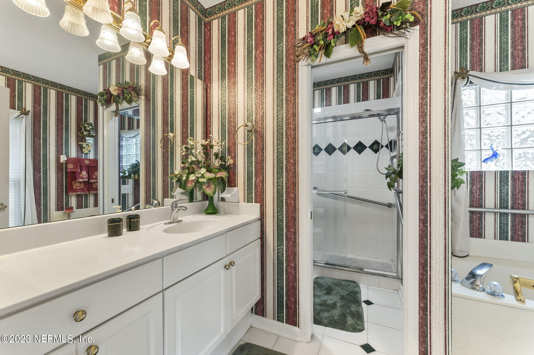 42 Harmony Hall Road Middleburg, FL 32068 - Photo 28 of 70 a bathroom with a sink double vanity and a mirror