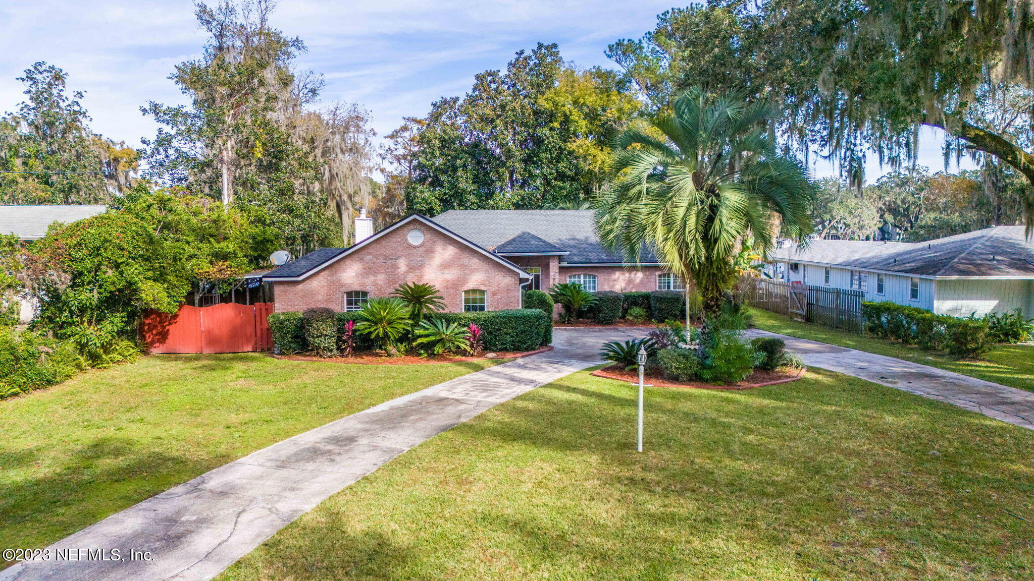 42 Harmony Hall Road Middleburg, FL 32068 - Photo 46 of 70 a house that has a tree in front of it