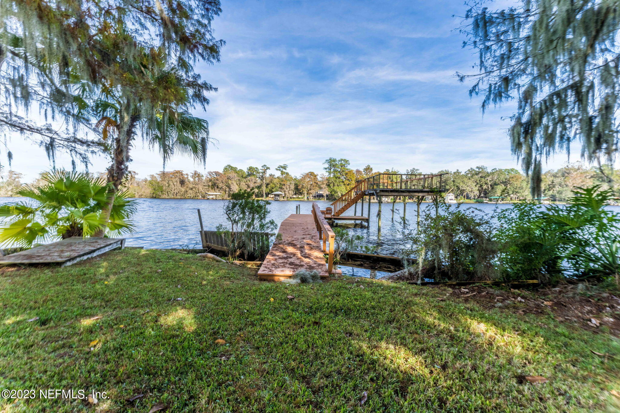 42 Harmony Hall Road Middleburg, FL 32068 - Photo 65 of 70 a view of a garden with a bench in a garden