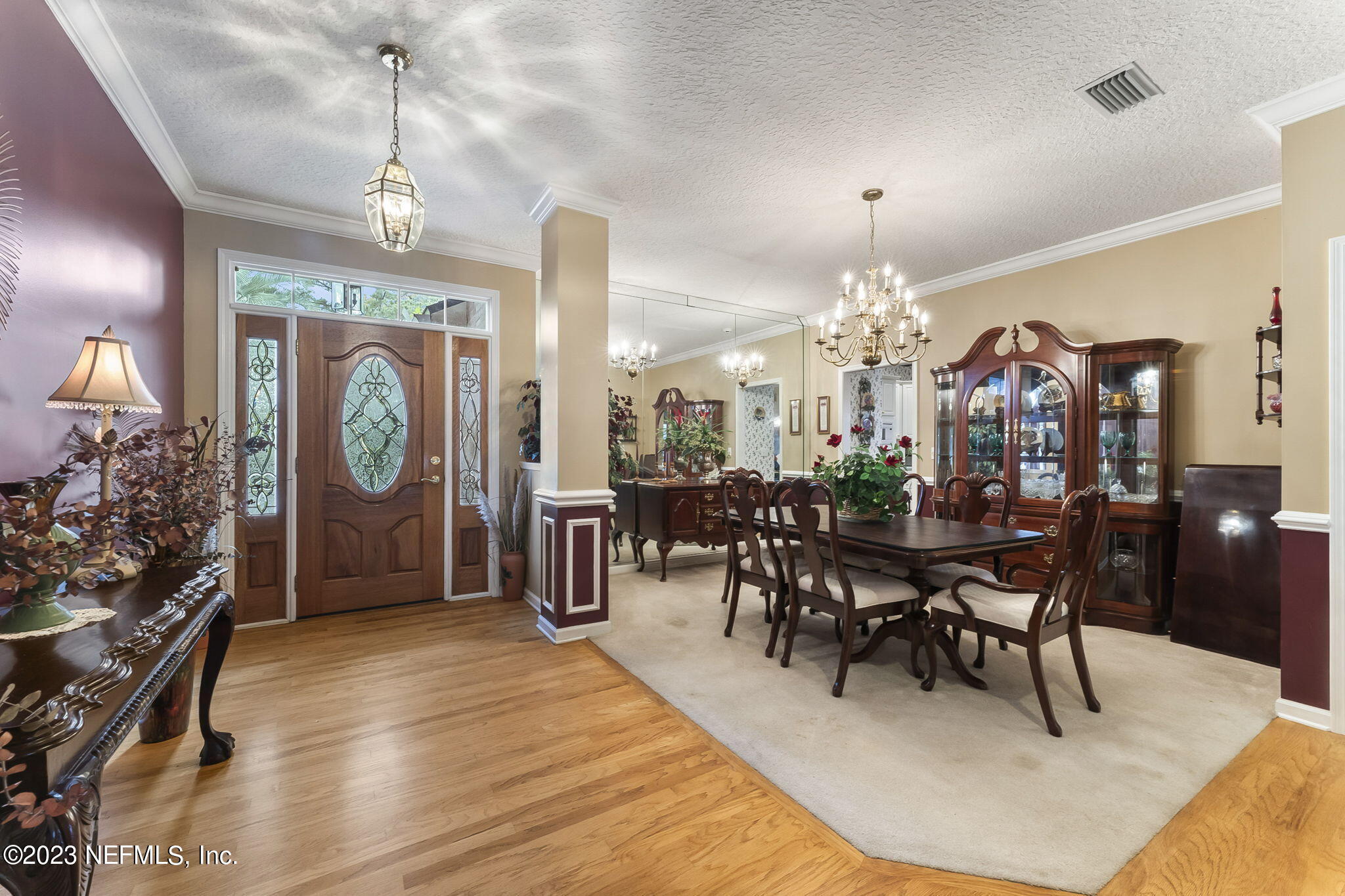 42 Harmony Hall Road Middleburg, FL 32068 - Photo 7 of 70 a view of a dining room with furniture and chandelier