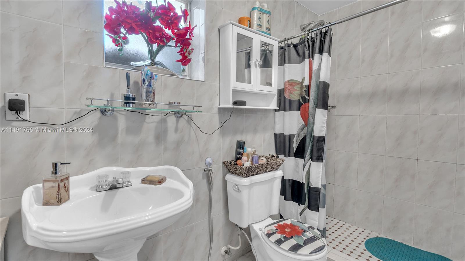 770 Southeast 4th Place Hialeah, FL 33010 - Photo 15 of 19 a bathroom with a sink toilet and shower
