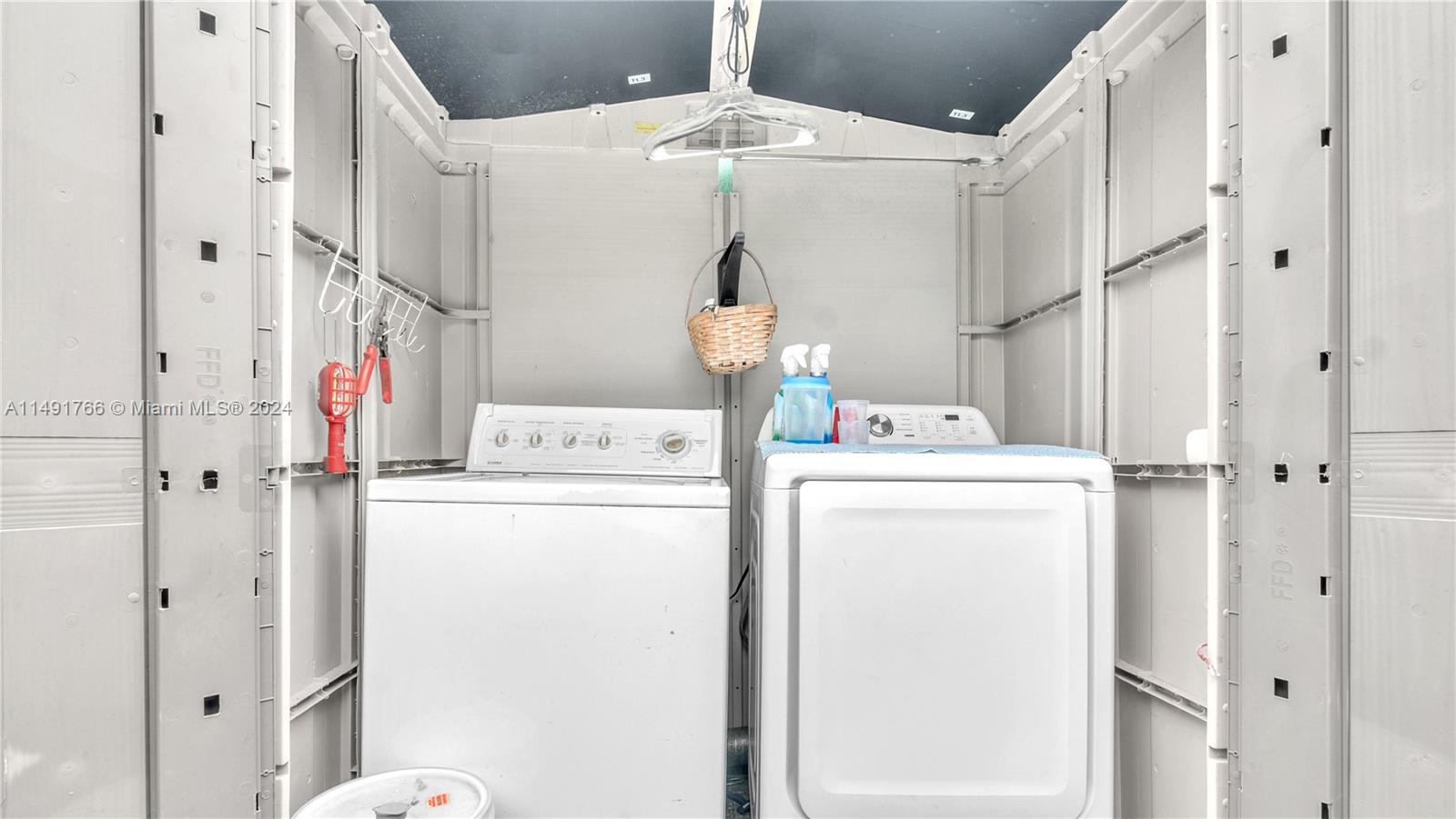 770 Southeast 4th Place Hialeah, FL 33010 - Photo 19 of 19 a utility room with dryer and washer