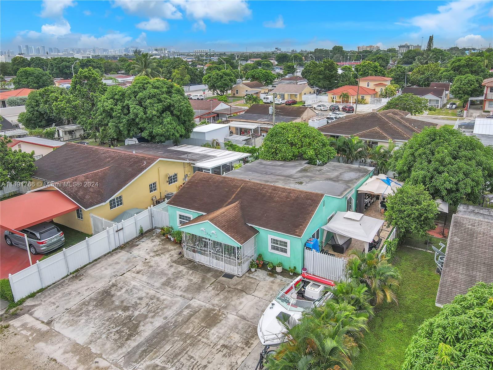 770 Southeast 4th Place Hialeah, FL 33010 - Photo 4 of 19 an aerial view of a house with a garden