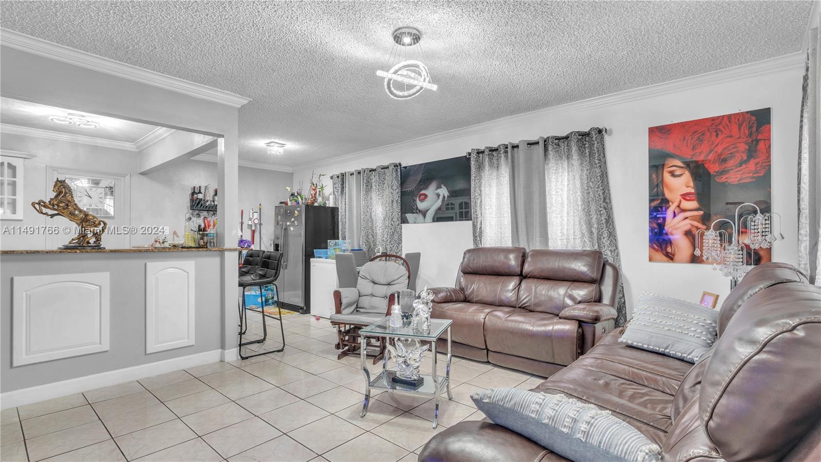 770 Southeast 4th Place Hialeah, FL 33010 - Photo 9 of 19 a living room with furniture and kitchen view