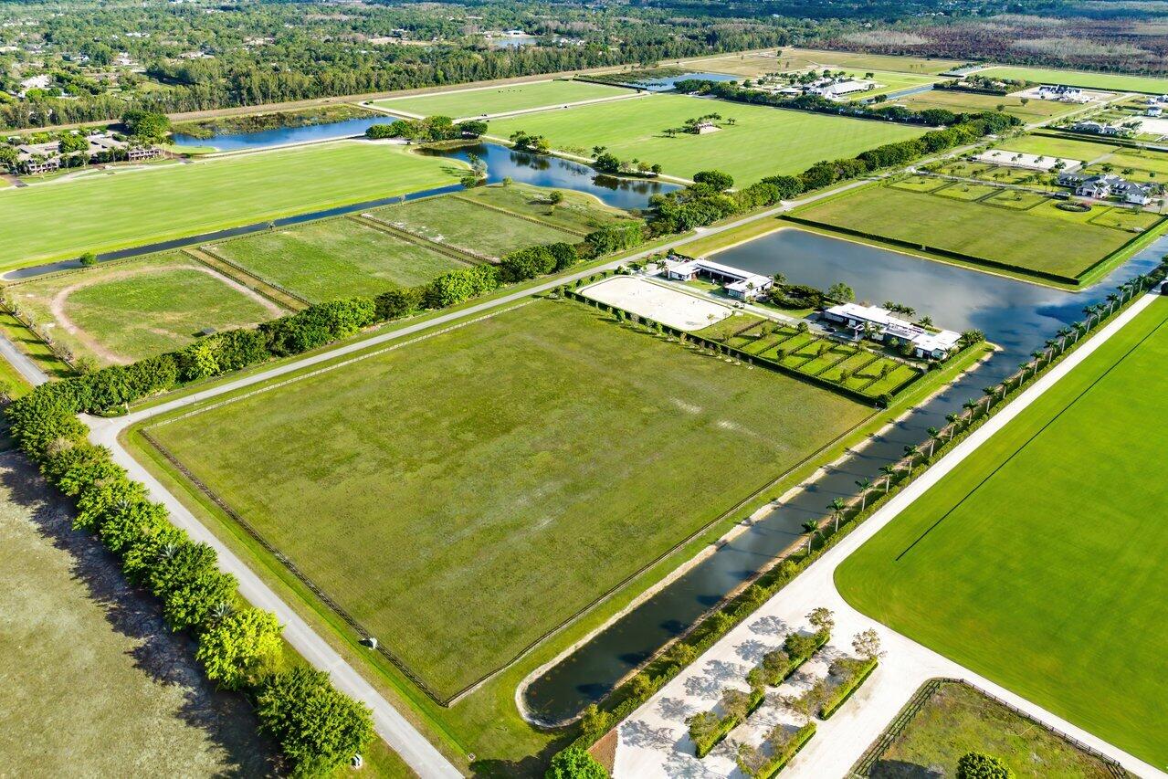 5111 Lasso Way Wellington, FL 33449 - Photo 2 of 12 a view of a tennis court