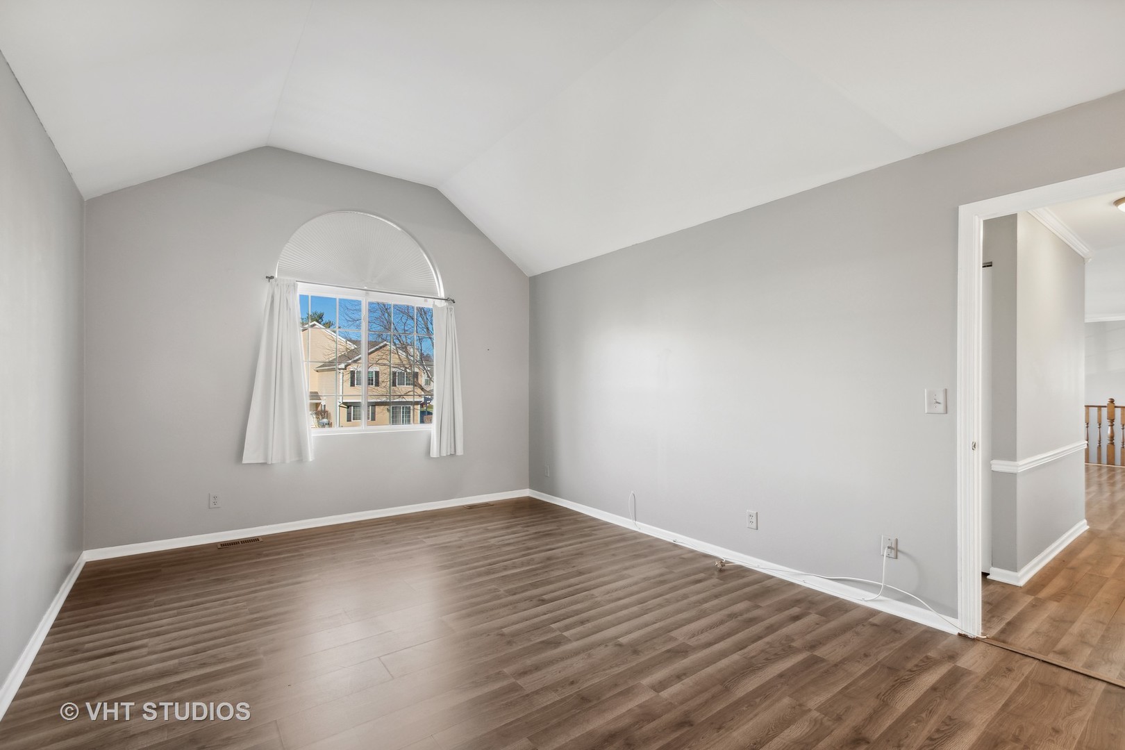 618 Silver Creek Road, Unit 618 Woodstock, IL 60098 - Photo 12 of 21 an empty room with wooden floor and window