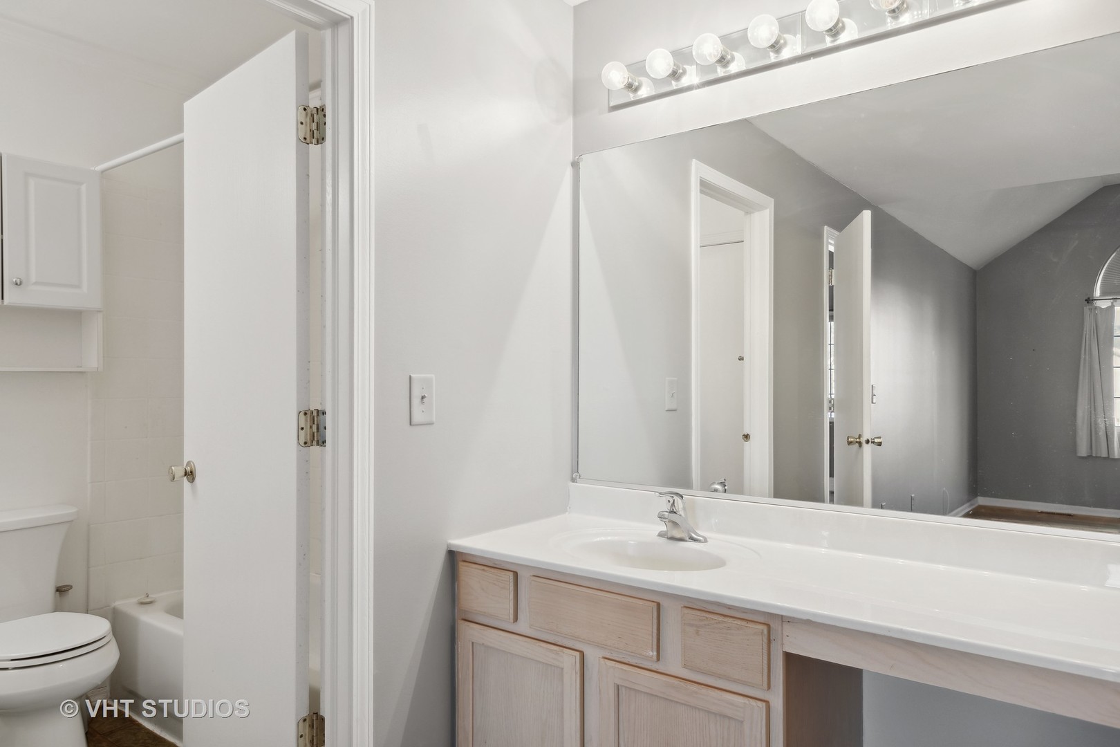 618 Silver Creek Road, Unit 618 Woodstock, IL 60098 - Photo 13 of 21 a bathroom with a sink a toilet and shower