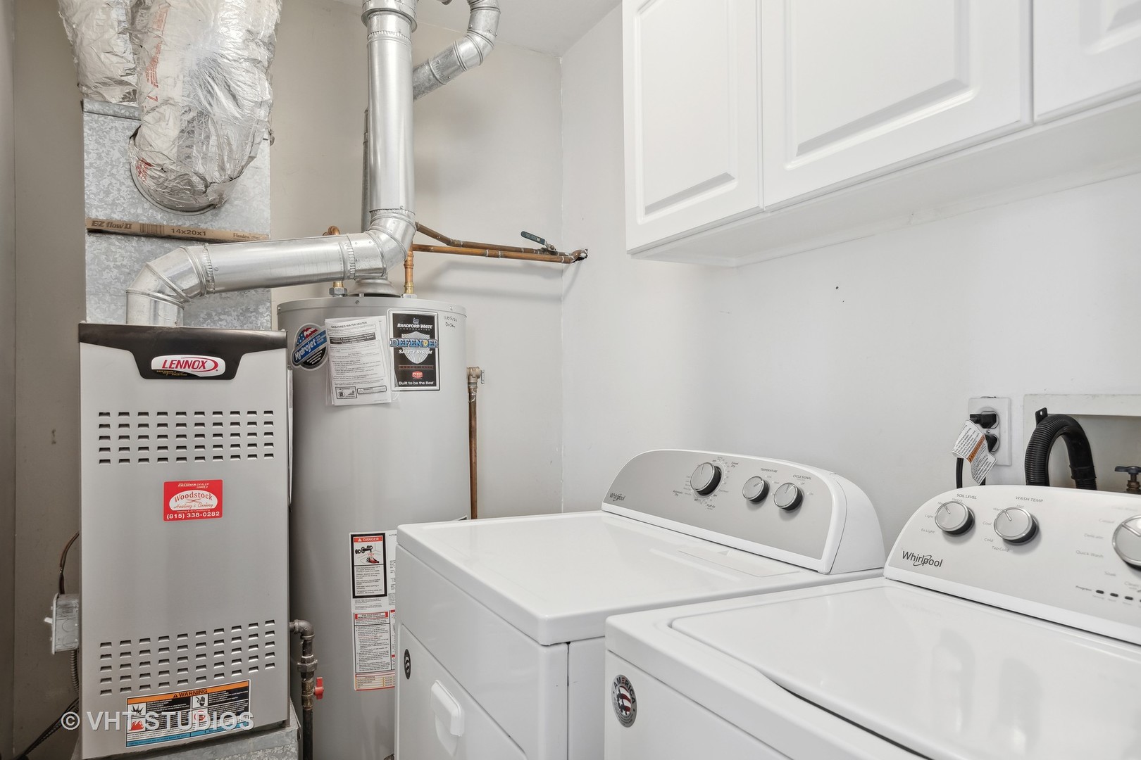 618 Silver Creek Road, Unit 618 Woodstock, IL 60098 - Photo 15 of 21 a utility room with dryer and washer