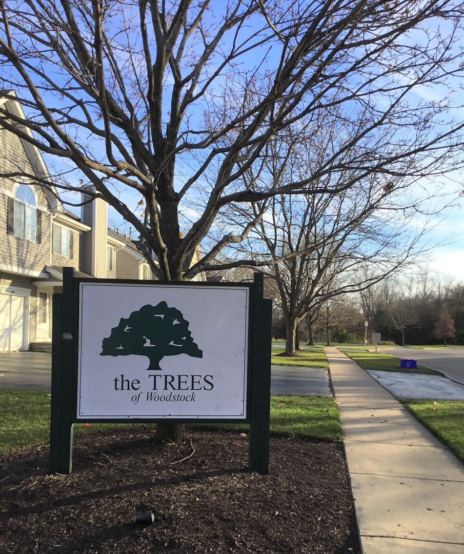 618 Silver Creek Road, Unit 618 Woodstock, IL 60098 - Photo 20 of 21 a sign on the side of a road