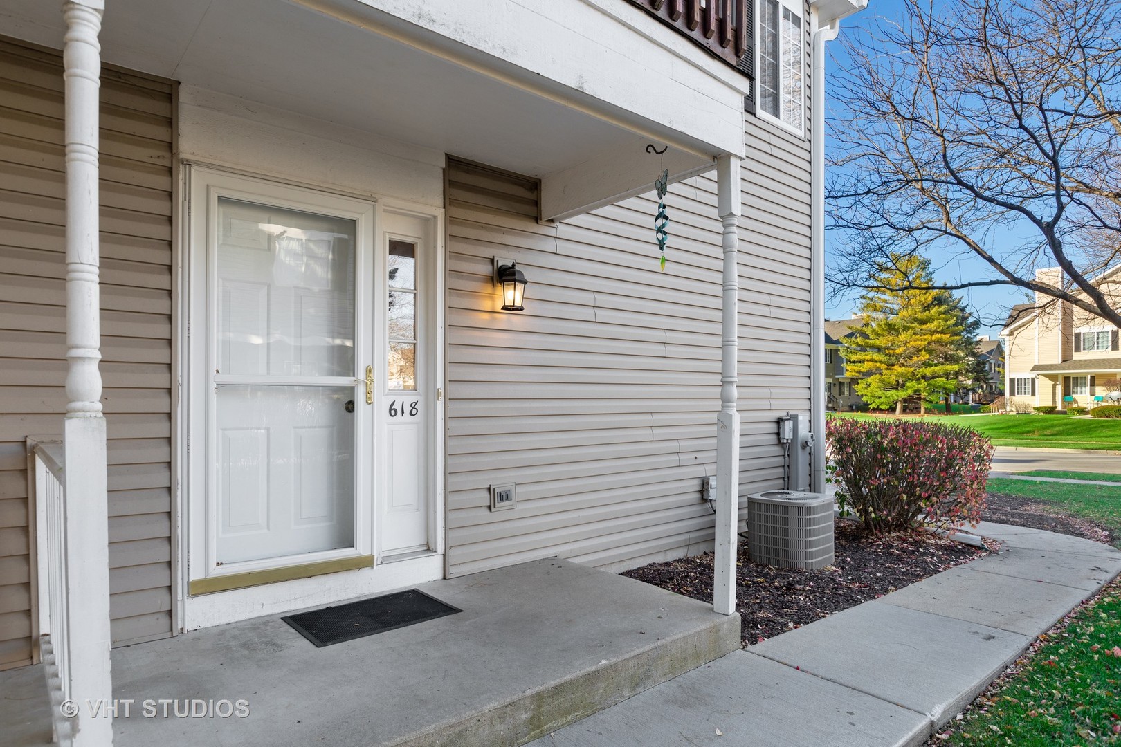 618 Silver Creek Road, Unit 618 Woodstock, IL 60098 - Photo 3 of 21 a view of a house with a yard