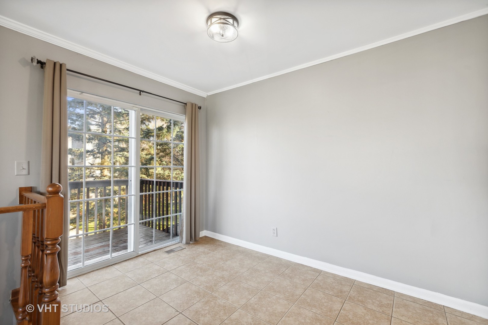 618 Silver Creek Road, Unit 618 Woodstock, IL 60098 - Photo 5 of 21 an empty room with windows