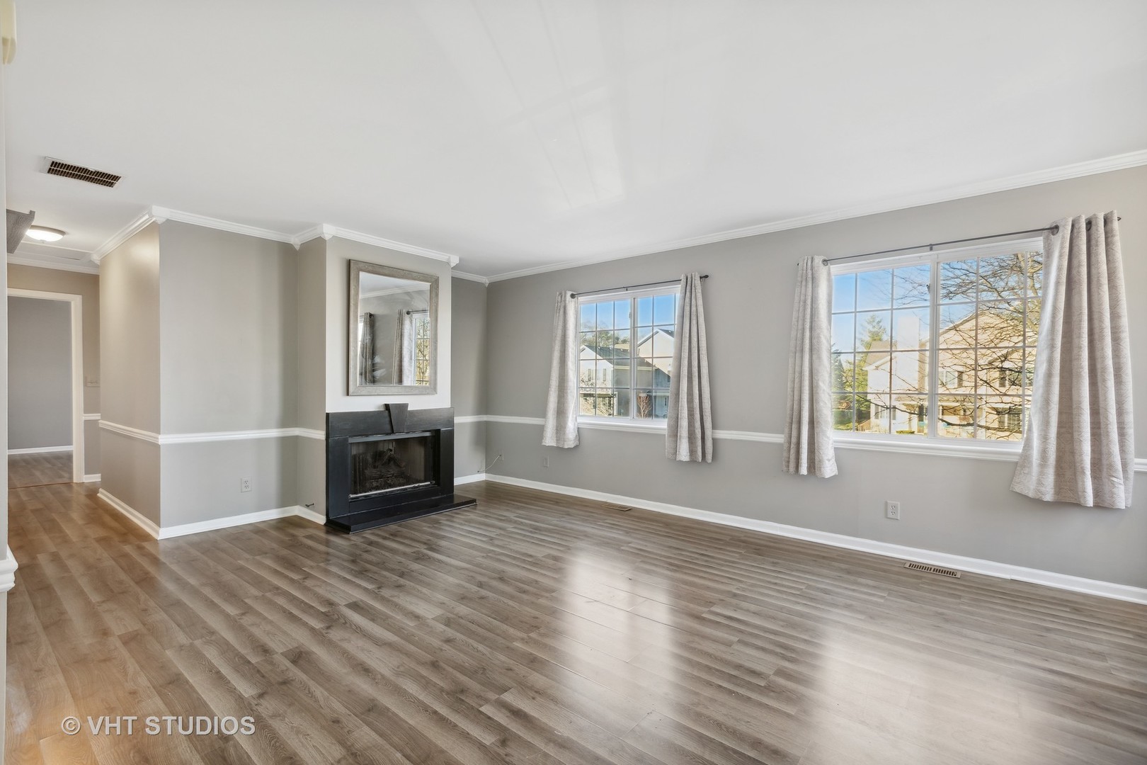 618 Silver Creek Road, Unit 618 Woodstock, IL 60098 - Photo 9 of 21 a view of livingroom with furniture wooden floor and window