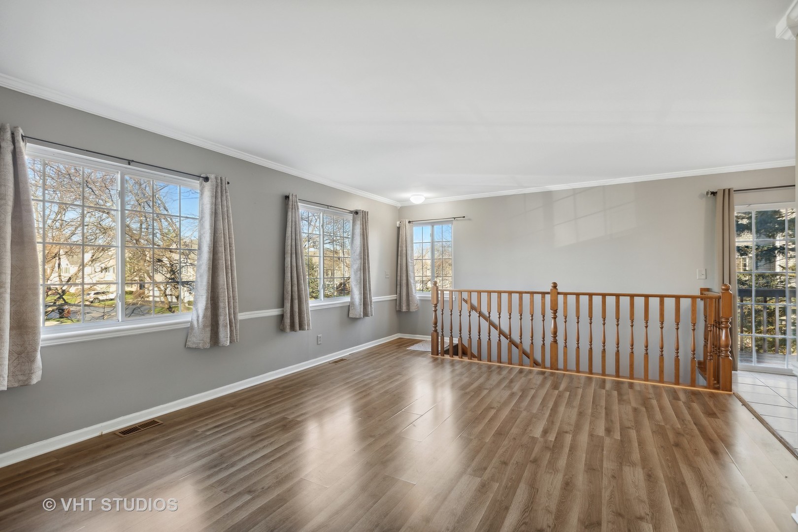 618 Silver Creek Road, Unit 618 Woodstock, IL 60098 - Photo 10 of 21 a view of an empty room with wooden floor and a window
