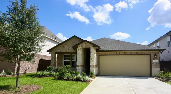 a front view of house with garden
