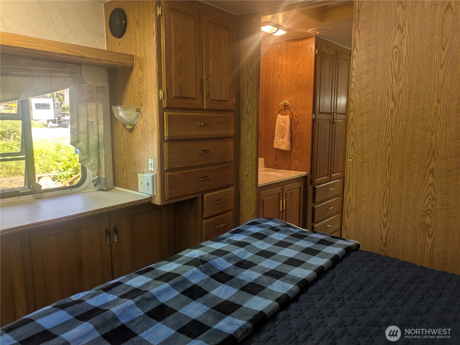 44957 Kachess Trail, Unit 2C97 Concrete, WA 98237 - Photo 9 of 16 a bedroom with a bed and a dresser