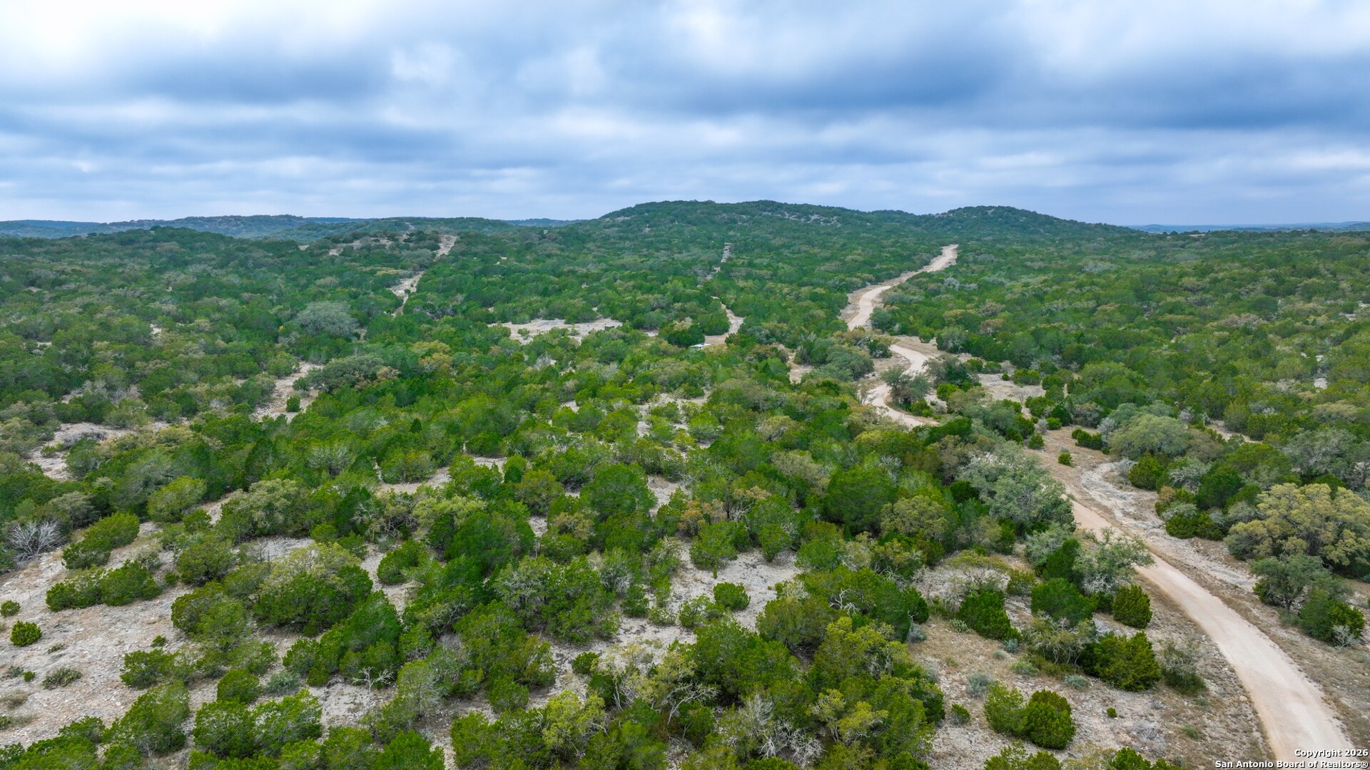 Lot 13 Wild Canyon Ranch Del Rio, TX 78840 - Photo 14 of 39 a view of a city with lush green forest