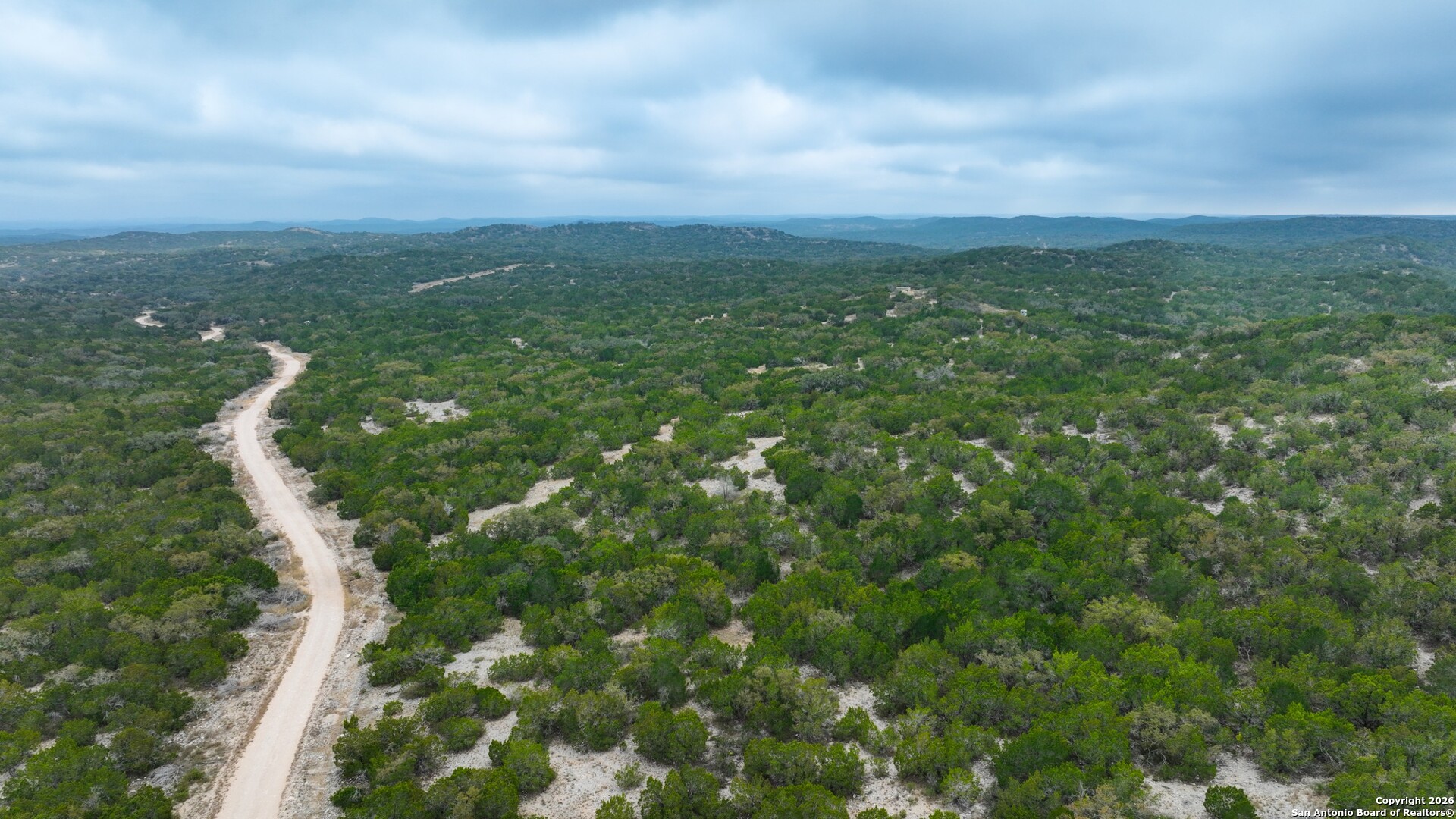 Lot 13 Wild Canyon Ranch Del Rio, TX 78840 - Photo 19 of 39 a view of a city and lush green forest