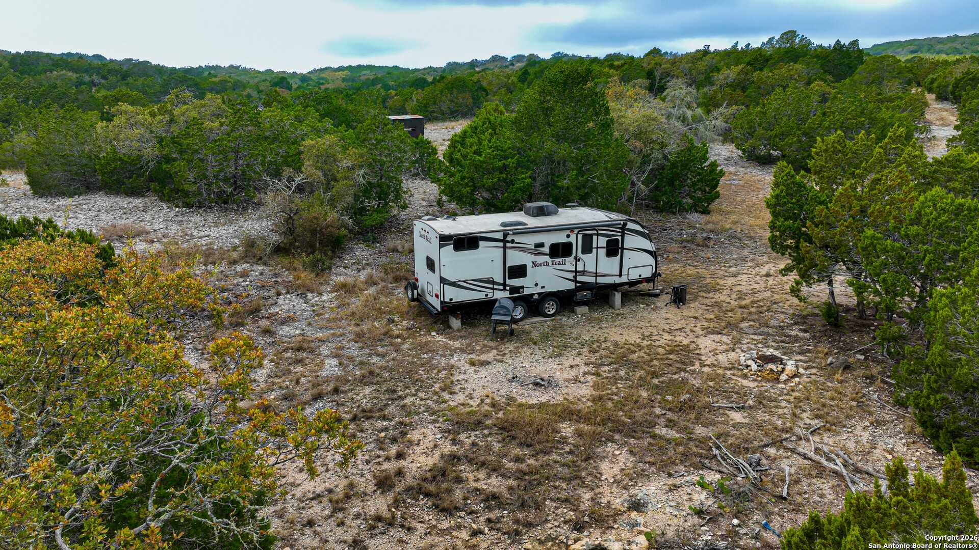Lot 13 Wild Canyon Ranch Del Rio, TX 78840 - Photo 2 of 39 an aerial view of a house with a yard