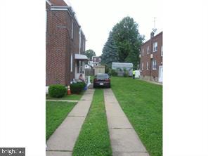 7238 Dungan Road Philadelphia, PA 19111 - Photo 2 of 15 a front view of a house with a yard